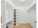 Well-organized closet with built-in shelving and storage spaces, perfect for wardrobe and accessories at 27477 Old Trilby Rd, Brooksville, FL 34602