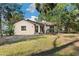 Charming single-story home with a well-manicured lawn and a welcoming front entrance at 27477 Old Trilby Rd, Brooksville, FL 34602