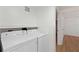 Bright laundry room features a side-by-side washer and dryer setup at 27477 Old Trilby Rd, Brooksville, FL 34602