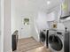 Well-equipped laundry room with modern washer and dryer, offering convenience and efficiency at 27477 Old Trilby Rd, Brooksville, FL 34602