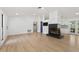 The living room is open with a striking fireplace, and access to the kitchen and backyard at 27477 Old Trilby Rd, Brooksville, FL 34602