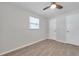Bedroom featuring wood-look tile floor, ceiling fan, and a closet at 2873 Karen Ave, Largo, FL 33774