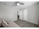 Bedroom with neutral walls and tile flooring, featuring a door to the kitchen and a view to the outside at 2873 Karen Ave, Largo, FL 33774