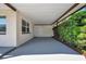 Covered carport with direct access to the home and mature landscaping at 2873 Karen Ave, Largo, FL 33774