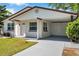 This lovely home features a convenient carport and well-maintained landscaping, offering curb appeal at 2873 Karen Ave, Largo, FL 33774