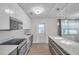 Bright kitchen showcasing stainless appliances, a center island, and modern pendant lighting at 2873 Karen Ave, Largo, FL 33774