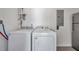 Modern laundry room featuring updated appliances and clean, white walls at 2873 Karen Ave, Largo, FL 33774