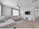 Comfortable living room with a ceiling fan, tile flooring, and neutral tones, ideal for relaxing at 2873 Karen Ave, Largo, FL 33774
