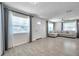 Comfortable living room with large windows, neutral colors, and tile floors for easy maintenance at 2873 Karen Ave, Largo, FL 33774