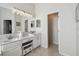 Bathroom features dual sinks, white cabinetry, and a separate water closet for added privacy at 2919 Northfield Dr, Tarpon Springs, FL 34688