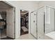 Primary bathroom features a glass-enclosed shower, walk-in closet, and access to the primary bedroom at 2919 Northfield Dr, Tarpon Springs, FL 34688