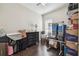 Bedroom with hardwood flooring, blinds, ceiling fan, and ample storage at 2919 Northfield Dr, Tarpon Springs, FL 34688