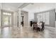Spacious dining room with tile floors, chandelier, and views into other living areas at 2919 Northfield Dr, Tarpon Springs, FL 34688