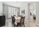 Cozy dining area with modern chandelier and views into kitchen at 2919 Northfield Dr, Tarpon Springs, FL 34688