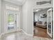 Bright foyer showcasing a beautiful glass front door and view into the office at 2919 Northfield Dr, Tarpon Springs, FL 34688