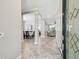 Elegant foyer featuring tile floors and a view of the dining and living areas at 2919 Northfield Dr, Tarpon Springs, FL 34688