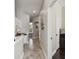 Hallway with tile flooring, convenient workspace, and plenty of storage solutions at 2919 Northfield Dr, Tarpon Springs, FL 34688
