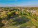 Aerial view of a well-maintained community sports field with soccer goals and lush green surroundings at 2919 Northfield Dr, Tarpon Springs, FL 34688