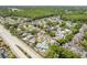 Aerial view of the property showcasing its mature landscaping, pool, and desirable neighborhood location at 3647 Scarlet Tanager Dr, Palm Harbor, FL 34683