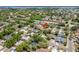 An aerial view showing the property's location within a neighborhood near a lake and highway, marked with a red arrow at 3647 Scarlet Tanager Dr, Palm Harbor, FL 34683