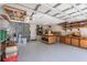 A well-organized garage with ample workspace and storage solutions for hobbyists and DIY enthusiasts at 3647 Scarlet Tanager Dr, Palm Harbor, FL 34683