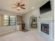 Functional office space featuring a fireplace, neutral walls, and a window offering natural light, perfect for remote work at 3647 Scarlet Tanager Dr, Palm Harbor, FL 34683