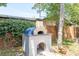 A custom outdoor pizza oven adds charm and character to the backyard space at 3647 Scarlet Tanager Dr, Palm Harbor, FL 34683