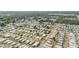 Wide aerial shot showcasing the expansive layout of the community with many homes at 37229 Cora Ave, Zephyrhills, FL 33542