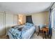 Relaxing bedroom with a comfortable bed, ample closet space, and a serene ambiance at 37229 Cora Ave, Zephyrhills, FL 33542