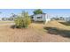Charming mobile home featuring a well-maintained exterior and landscaped flower bed under an awning at 37229 Cora Ave, Zephyrhills, FL 33542