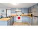 Functional kitchen featuring wood countertops, ample cabinet space, and essential appliances at 37229 Cora Ave, Zephyrhills, FL 33542