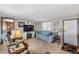 Inviting living room with cozy seating, a TV, and a welcoming atmosphere at 37229 Cora Ave, Zephyrhills, FL 33542