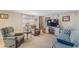 Comfortable living room featuring cozy furniture and entertainment center at 37229 Cora Ave, Zephyrhills, FL 33542