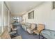 Screened-in porch featuring comfortable seating arrangements and tile flooring at 37229 Cora Ave, Zephyrhills, FL 33542