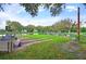 Relaxing recreation area by the lake with spots to practice your short game on a sunny day at 37229 Cora Ave, Zephyrhills, FL 33542