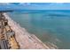 Aerial view of the beach and ocean with building next to a beautiful shoreline at 400 150Th Ave # 506, Madeira Beach, FL 33708