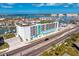 An aerial view of the Residences showcasing its premium bayside location, rooftop deck, and water views at 400 150Th Ave # 506, Madeira Beach, FL 33708