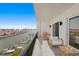 Balcony seating with waterfront views of boats and beautiful blue skies at 400 150Th Ave # 506, Madeira Beach, FL 33708