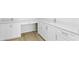 Bathroom featuring white cabinets, double sinks, and luxury countertops at 400 150Th Ave # 506, Madeira Beach, FL 33708