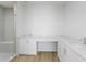 Modern bathroom with a glass shower, a large vanity, and bright lighting at 400 150Th Ave # 506, Madeira Beach, FL 33708