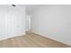 Bedroom featuring an open floor plan with light colored hardwood floors and neutral paint at 400 150Th Ave # 506, Madeira Beach, FL 33708