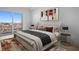 Relaxing bedroom featuring balcony access, neutral tones, and sophisticated decor at 400 150Th Ave # 506, Madeira Beach, FL 33708