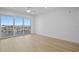 Bright, spacious bedroom with balcony access offering scenic neighborhood views at 400 150Th Ave # 506, Madeira Beach, FL 33708