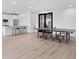 Spacious recreation room featuring sleek white cabinets, a quartz countertop, and a ping pong table at 400 150Th Ave # 506, Madeira Beach, FL 33708