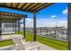 Relaxing rooftop terrace featuring lounge chairs under pergola with ocean views at 400 150Th Ave # 506, Madeira Beach, FL 33708