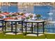 Rooftop terrace featuring pergola lounges overlooking the waterfront at 400 150Th Ave # 506, Madeira Beach, FL 33708
