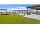 Modern rooftop terrace featuring lounge areas, comfortable seating and green turf at 400 150Th Ave # 506, Madeira Beach, FL 33708