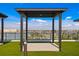 Rooftop terrace lounge featuring a pergola and beautiful waterfront views at 400 150Th Ave # 506, Madeira Beach, FL 33708