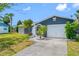 Inviting single-story home with a well-kept lawn, mature landscaping, and a cozy, screened entryway at 4124 Pine Dale Ct, Hernando Beach, FL 34607