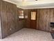 Living Room with wood paneling, tile flooring, and natural light at 4191 71St N Ave, Pinellas Park, FL 33781